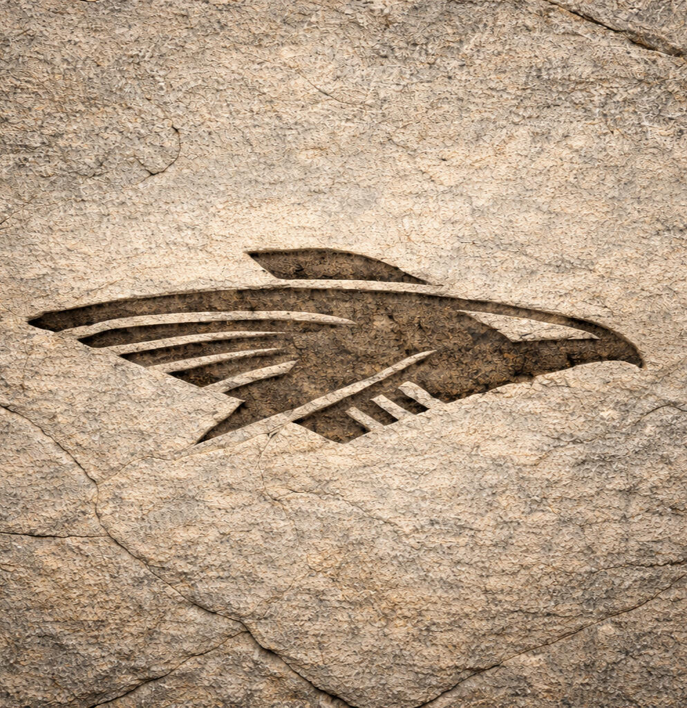 Falconer Consulting Logo Falconer Consulting logo engraved into a large stone surface with an aerospace-inspired falcon design.